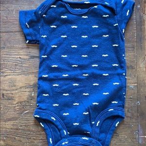 Carter’s mustache onesie